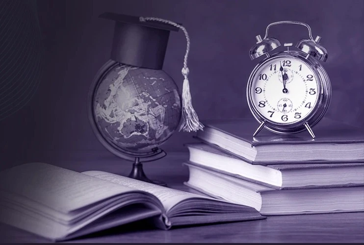 Books, a globe with a graduation cap, and a clock symbolizing global learning and digital education, representing elearning software development services for assessments, worksheet generators, and school or corporate training platforms.